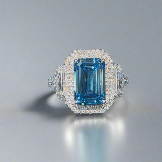 4.00CT VIVID BLUE EMERALD CUT DIAMOND 3 STONE RING
