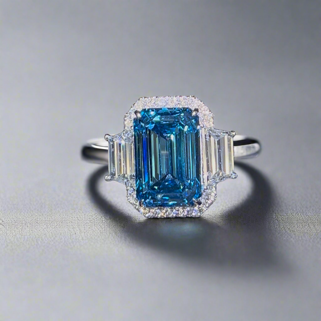 6.00CT VIVID BLUE EMERALD CUT 3 STONE RING