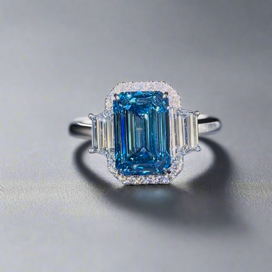 6.00CT VIVID BLUE EMERALD CUT 3 STONE RING
