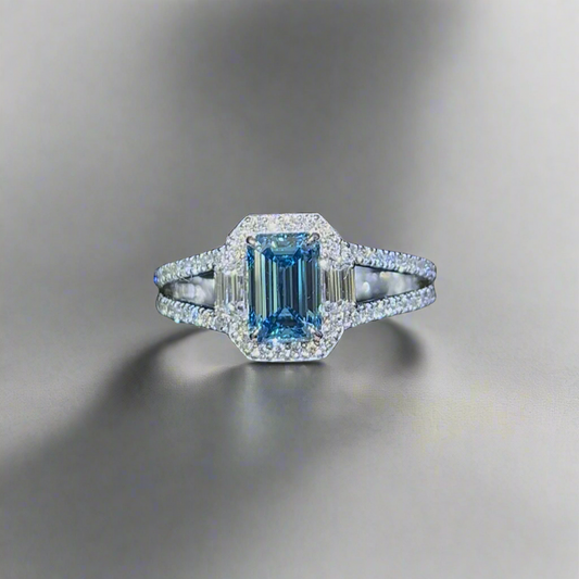 1.00CT VIVID BLUE DIAMOND EMERALD CUT 3 STONE RING